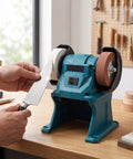 Daconovo 3 Inch Cordless Mini Bench Grinder With Dual 5500Rpm Wheels, sharpening a knife on a workstation.