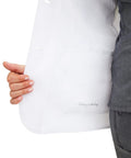 Inside view of Womens White Lab Coat With Five Pockets Full Sleeve 5160 Flo Relaxed Fit Exam Coat For Medical Professionals Minimalist Collection XL Button Front Closure For Easy On And Off showing inside pocket.