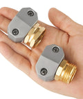 Aluminum Hose Repair Kit Set For 3/4 And 5/8 Inch Hoses With Male And Female End Fittings in a hand, zinc clamps visible