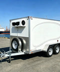 Sleek Portable Refrigerated Trailer Featuring Heavy Duty Mobile Cooling System For Catering Teams And Large Outdoor Events, rear view.