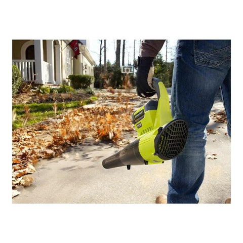 Heavy Duty Cordless Leaf Blower With Jet Fan Tech And Forty Volt Setup Sending Out One Fifty Five MPH Winds, holding in a yard.