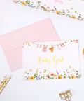 Baby girl greeting card with babysuit banner and pink envelope, part of Roomy 13 Inch Baby Shower Gift Bag With Pink Tissue Paper Gift Card And Bow Featuring A Babysuit Banner Ready To Gift For Girl Baby Shower Gifts Birthday Wrapping And Party Decor.