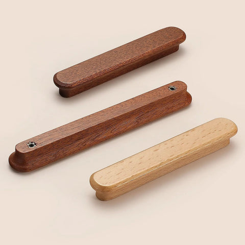 Three wooden drawer pulls in various brown tones on a beige background, not the Red Wood Round Wooden Drawer Knobs 5 Inch Single Hole shown.