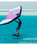 Person using pink and white Inflatable Windsurfing Wing For Windsurfing Wing Foil And Handheld Kite Surfing For Surf And Snow Skiing.