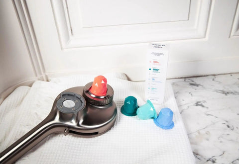Aromatherapy Hand Shower With INLY Technology And Spa Capsule Kit, Infuse Essential Oils, Chrome Finish on white towel with capsules