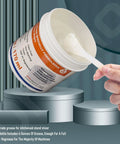 Front view of 6 oz food-grade grease tub for KitchenAid mixer, white container with orange label.