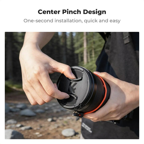 Person attaching 4 In 1 Center Pinch Lens Cap Kit to 49mm camera lens, easy snap on protection.