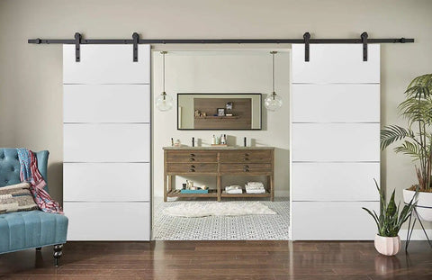 Double Barn Sliding Doors In Matte White 84 By 96 With Black Hardware 14 Ft Rails And Steel Hangers Modern Solid Core Closet Doors Ready To Install With Pre Drilled Holes Sleek And Durable in a living room setting.