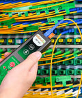 KFI-40 Fiber Optic Detector And Live Identifier testing cables, handheld tool in technician's hand at a panel with multiple fiber connections.