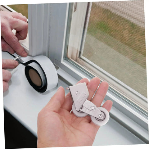 Person holding 4PC Premium Aluminum Alloy Sliding Door Pulley Wheels With Ball Bearing Replacement Rollers for patio door.