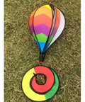 Rainbow Windsock Set Of 3 Hot Air Balloon Wind Spinners on grass, showcasing colorful panels for garden and yard decor.