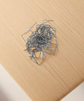 High Performance Hot Plastic Bumper Repair Welding Staples For Auto Body Work With Precision 0.8mm Rods piled on a wooden surface.