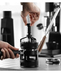 Pro Level 58mm Adjustable Espresso Puck Distribution Tool For Standard Portafilters Zero Mess Coffee Extraction in use.