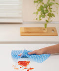 Reusable Kitchen Wipes, 60 Count, Rinse and Reuse Up to 10 Times, cleaning sauce spill on white surface