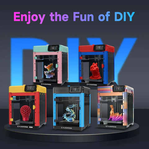 Colorful Adventurer 5M DIY 3D printers on display with printed models inside, showcasing enclosure accessories kit for safe printing.