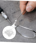 Close-up of Metal Eyeglass Screw Washers Set, 200 Pcs Rimless Glasses Gaskets and Frame Tighteners used on silver frames.