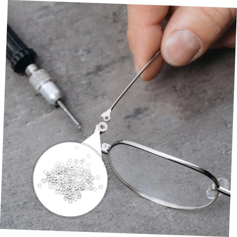 Close-up of Metal Eyeglass Screw Washers Set, 200 Pcs Rimless Glasses Gaskets and Frame Tighteners used on silver frames.