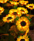 Two Pack Sunflower Solar Lights Outdoor Decor With 3 LED Yellow Flowers Waterproof in garden displaying vibrant glow at night