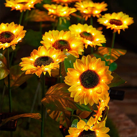 Two Pack Sunflower Solar Lights Outdoor Decor With 3 LED Yellow Flowers Waterproof in garden displaying vibrant glow at night