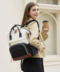 Woman carrying 15.6 Inch Laptop Backpack For Women With Wide Open Frame For Quick Access Waterproof Large Capacity Daypack outdoors