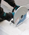 Heavy Duty 15 Amp Corded Angle Cutter With 14 Inch Super Joint System and AC or DC switch in use on concrete surface.