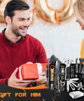 Man receiving survival gear kit for men with 27 in 1 complete tools including axe, fire starter, compass, flashlight, emergency blanket.