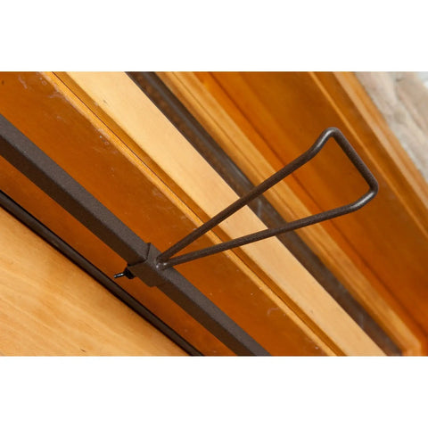 No Sweat Setup Front Door Garland Hanger With Thick Rubber Padded Ends For Year Round Decor Fits Wide Doorjambs No Drill Needed, shown mounted.