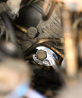 Close-up of 10-Piece Metric Flare Nut Crowfoot Wrench Set for Tight Spots gripping a fastener in a mechanical setting, 6-point head visible