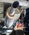 Covzoe exhaust hanger removal pliers with red handles detaching car muffler rubber hanger under the vehicle.