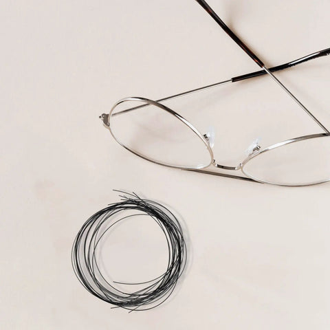 Replaceable Eyeglass Repair Thread Kit for Half-Frame Glasses with durable nylon thread, ideal for quick fixes and on-the-go repairs.