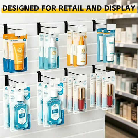 24 Pack Slatwall Hooks With Built In Price Tag Holder, Heavy Duty Metal Slatwall Accessories For Retail Display, Store Displays, Trade Shows, And Market Booths, Durable Black 12 Inch holding various product packages on a slatwall
