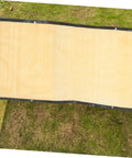 Privacy Screen Fence Net for Chain Link Fences laid on grass, showing beige heavy-duty garden privacy netting with grommets.