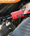 Person using 12V Electric Ratchet Wrench Set 3 By 8 Inch Drive on car engine for bolt fastening, 2000mAh Lithium Ion Battery