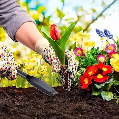 Gardener using Leaf Shaped Garden Trowel Tool 12 Inch Hand Shovel One Piece Forged High Carbon Steel for planting among flowers