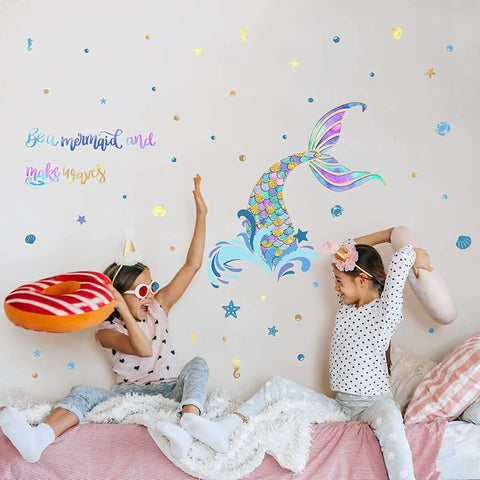 Two girls playing with pillows in a room with Homie Mermaid Wall Decals For Girls Nursery Room Decor And Kids Bedroom Decoration Tail Stickers Baby Girl Purple Tail Wall Decor Eco Friendly Safe Non Toxic Peel And Stick Removable Wall Art on wall.