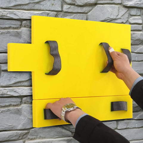 Person using Polyurethane Concrete Stamp Mat 19.69 By 11.81 Inches, with DIY friendly seamless texture for outdoor decor on stone wall.