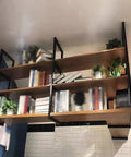 Premium Heavy Duty Floating Shelf Bracket Three Tier Ceiling Mount Design Industrial Metal Shelf Support For Kitchen Office Wall Storage Rack Built Tough As Nails with plants and books on wooden shelves.