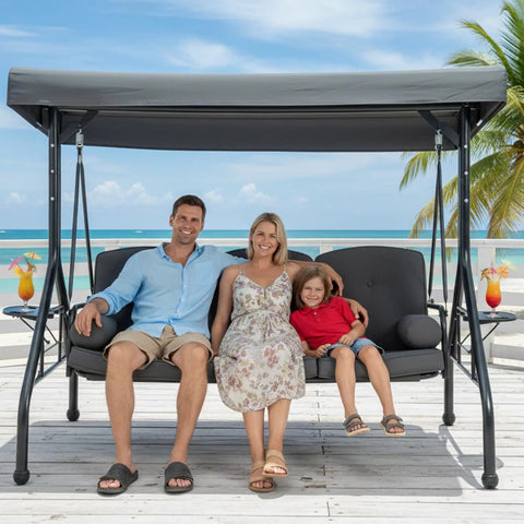 Three Seat Patio Swing With Canopy And Cup Holders, Heavy Duty Steel Frame, Weather Resistant Outdoor Swing Bench, beachside view