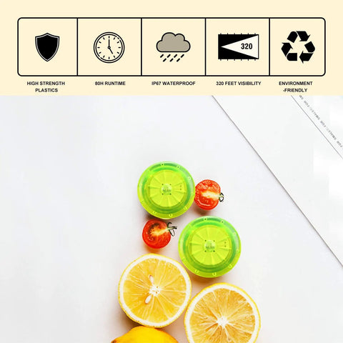 Two green bike wheel lights with batteries included, shown with sliced lemons, for safer night riding waterproof with three color modes.