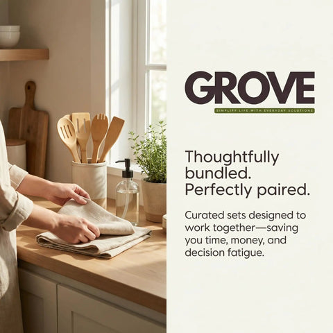 Person arranging kitchen towels with wooden utensils and plant by window on countertop.