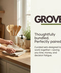 Person arranging towels on a kitchen countertop with wooden utensils and a potted plant beside them, brand logo visible.