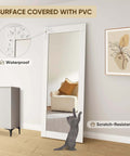 36x80 Inch Mirror Barn Door With Sliding Hardware Kit Included Full Length One Lite Mirror Door White Finish Solid Wood Core With Waterproof PVC Surface Scratch Resistant No Assembly Required installed in living room with couch and artwork visible in reflection