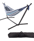 Double Outdoor Hammock With Stand And Carry Bag For Travel Or Backyard Lightweight Portable Setup With Powder Coated Steel Frame Blue Stripe Soft Polycotton Fabric For Easy Kick Back Lounging, shown with black steel frame and carrying bag underneath.