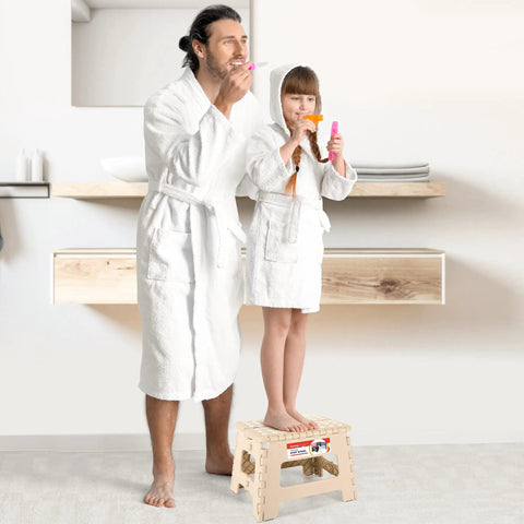 Adult and child using Lightweight 9 Inch Foldable Step Stool, Non Slip Plastic Stool For Bathroom, Khaki, in front of mirror.