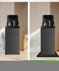 Non-Slip Silicone Water Cooler Mat With Raised Edge For Floor Protection Under Water Dispenser 22 By 19 Inches Spill-Proof Mat Keeps Floors Dry In Bedrooms Kitchens Offices Bars Black shown in use on a wooden floor under a water dispenser.