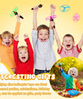 Kids joyfully playing with Disk Helicopter Toy Set With 12 String Launchers And 24 Flying Saucers For Outdoor Fun