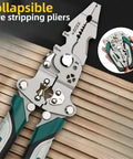 Kick Ass Heavy Duty Foldable Wire Stripping Pliers With Precision Electrical Crimping And Sharp Cutting Blades shown open on wooden surface.