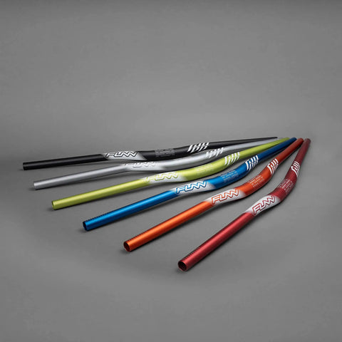 Full On Mountain Bike Handlebar, 31.8mm Clamp, 785mm Wide, 30mm Rise Beefy Alloy Riser Bar, different colors displayed in a line