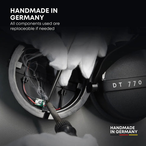 Hands assembling DT 770 Pro X Wired Studio Headphones 48 Ohm Closed Back, showing internal components, Handmade in Germany, Black.