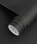 Roll of Matte Black Peel And Stick Wallpaper 17 By 120 Inch Self Adhesive Vinyl showing texture and grid lines inside.